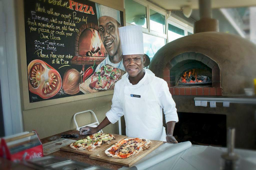 Blue Waters Hotel Durban Exterior photo Chef preparing pizza at the restaurant